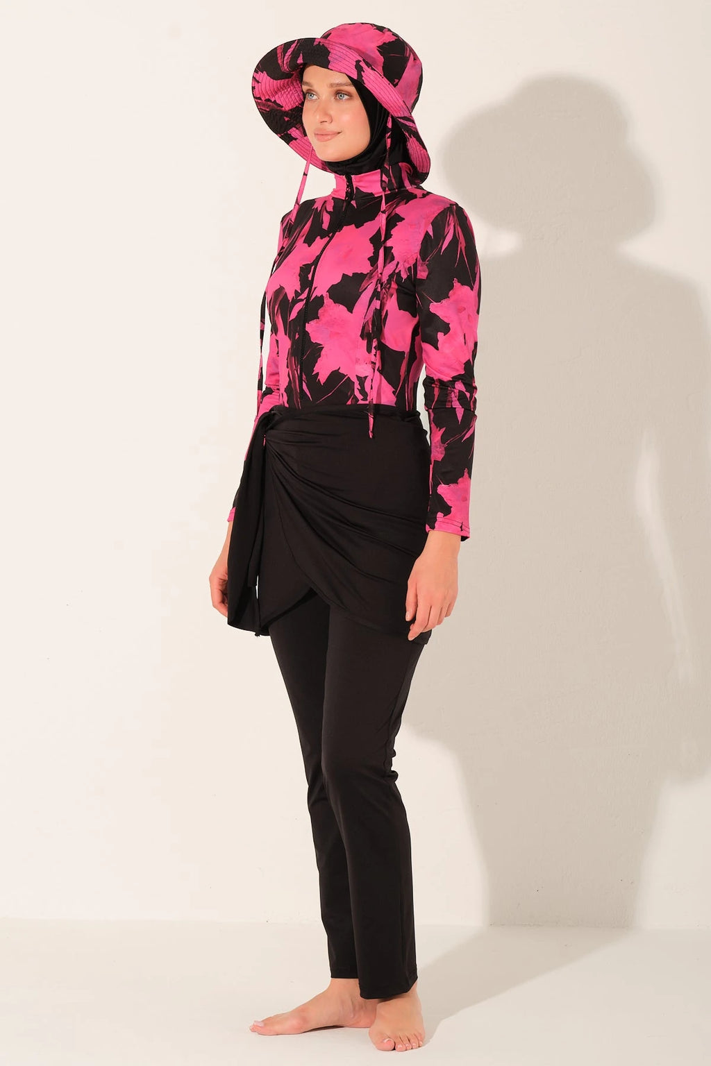 Active floral burkini set side view, woman posing.
