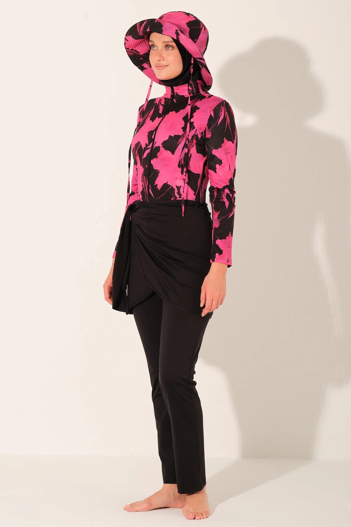 Active floral burkini set side view, woman posing.