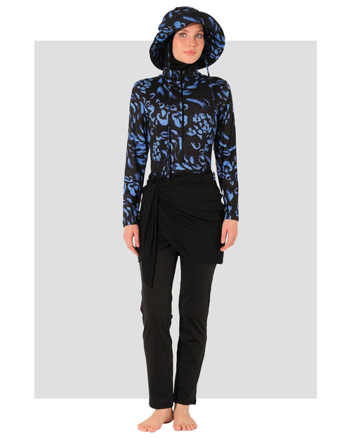 Model wearing midnight bloom burkini set, front view on grey background.