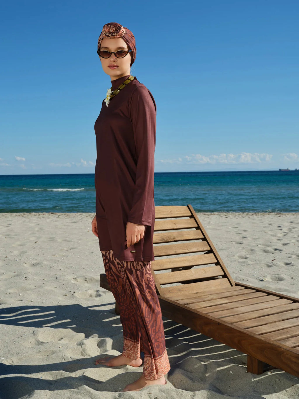 Side profile of model in mocha print burkini with kimono.
