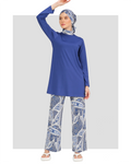Model in blue Lycra burkini with abstract print pants, front view.