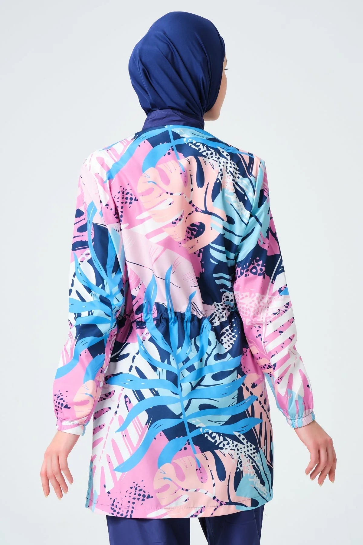 Back view of tropical print burkini top with adjustable waist drawstring.