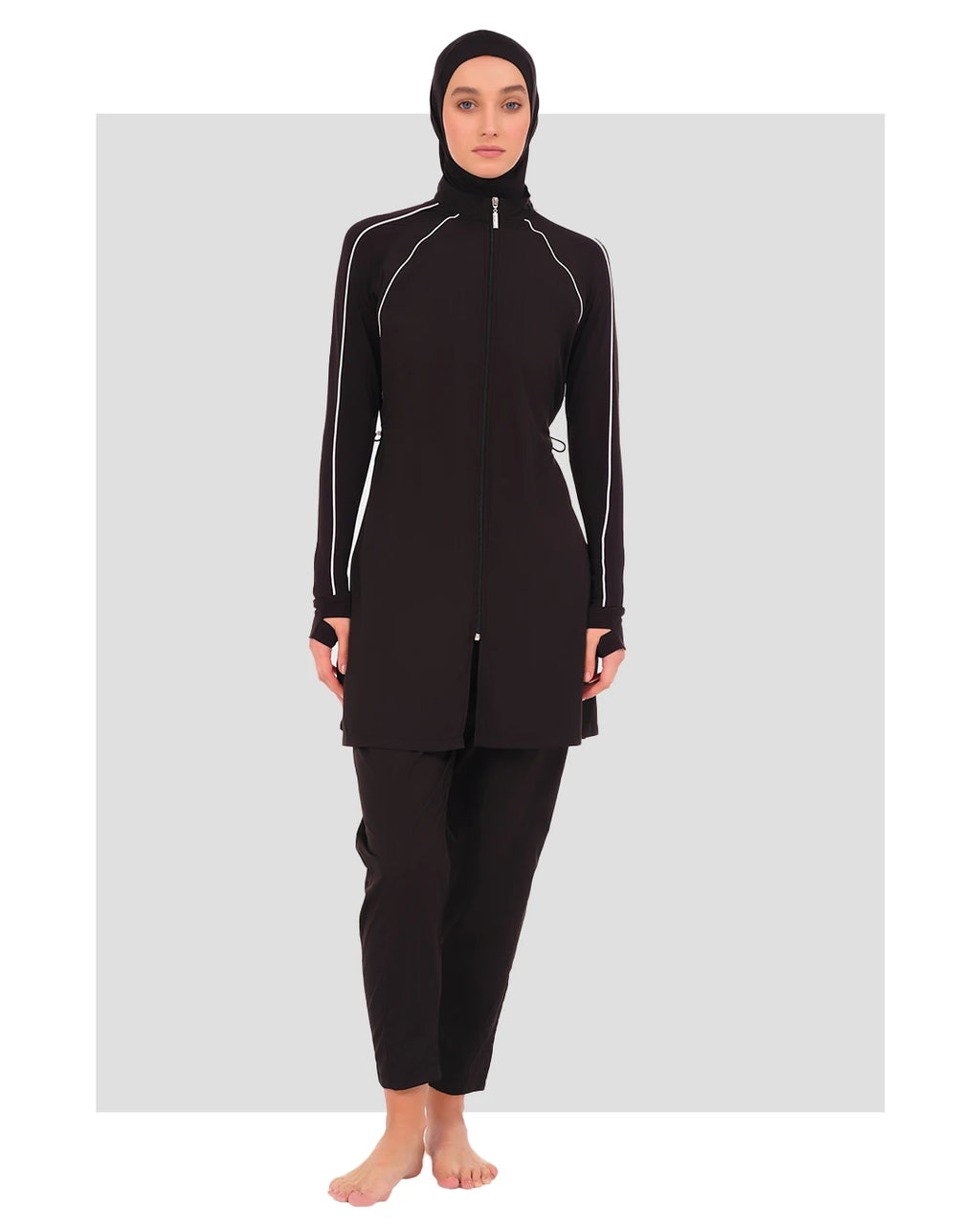 Black sporty burkini with white piping, front view on a plain background.
