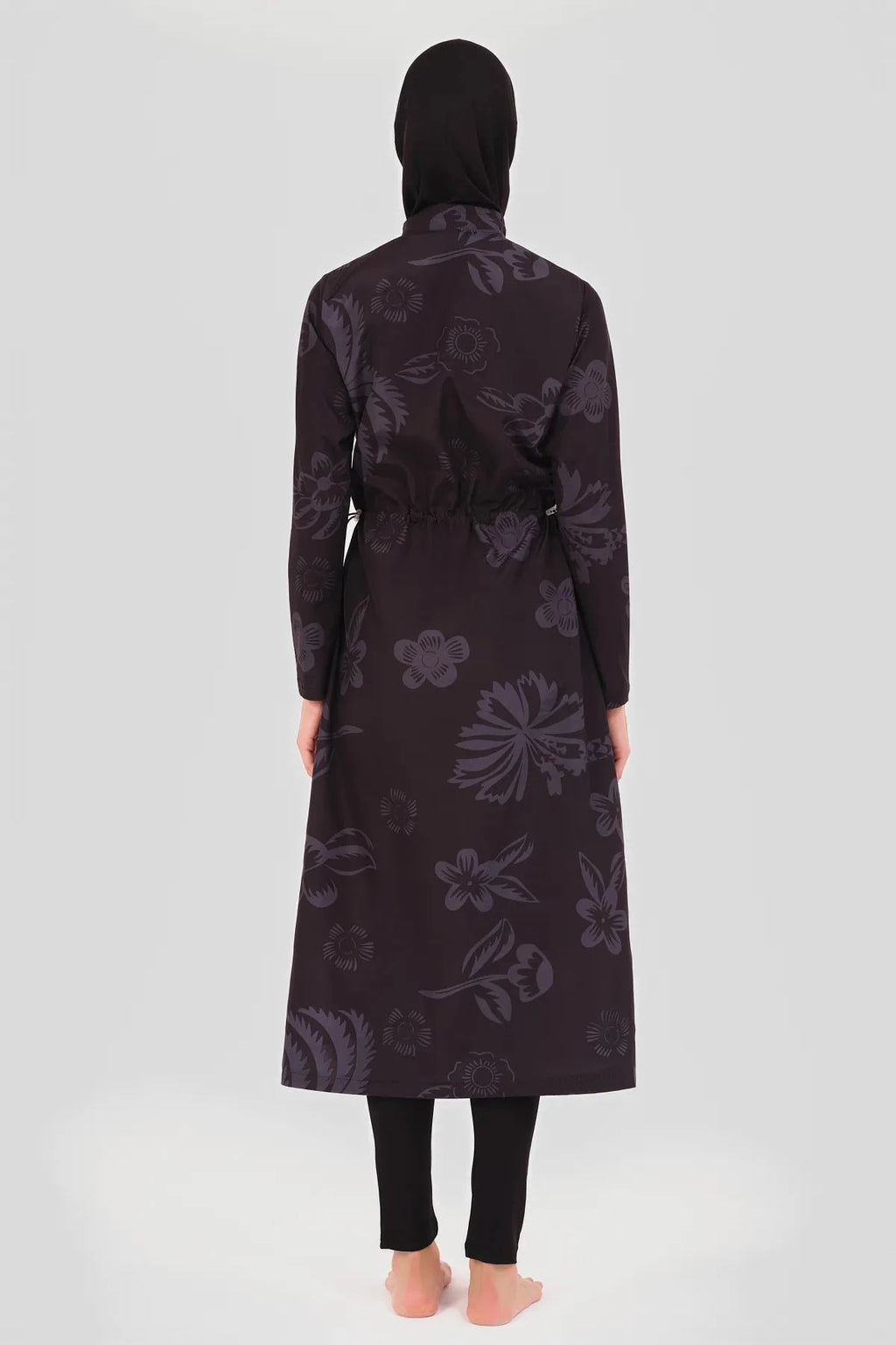 Back view of a fuchsia graphic print burkini with an adjustable waist tie.