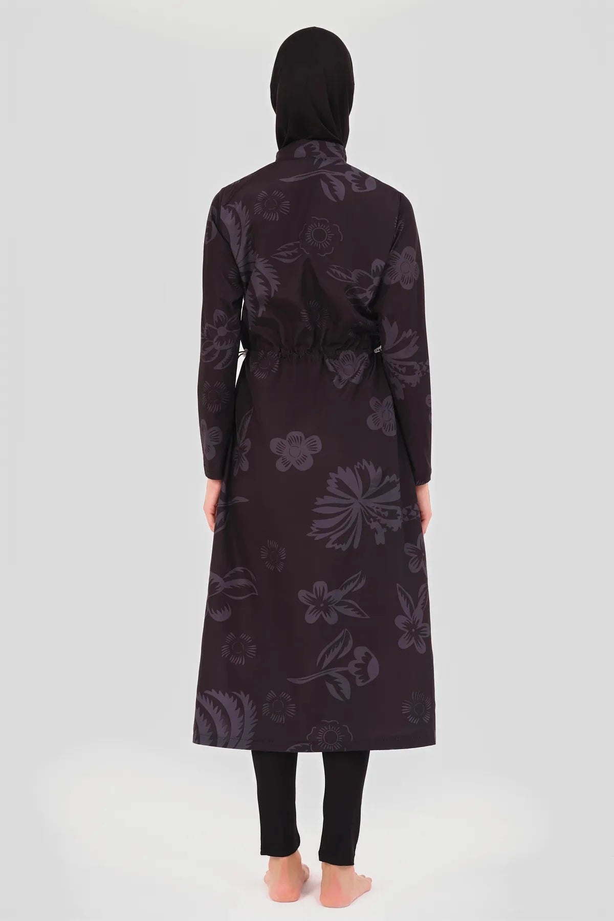 Back view of a fuchsia graphic print burkini with an adjustable waist tie.