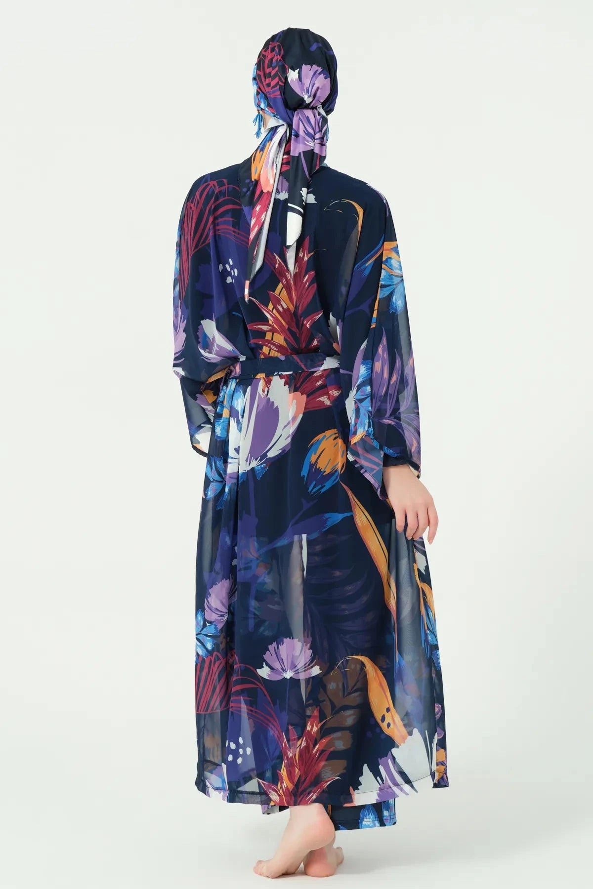 Midnight bloom burkini set with sheer floral kimono, back view.
