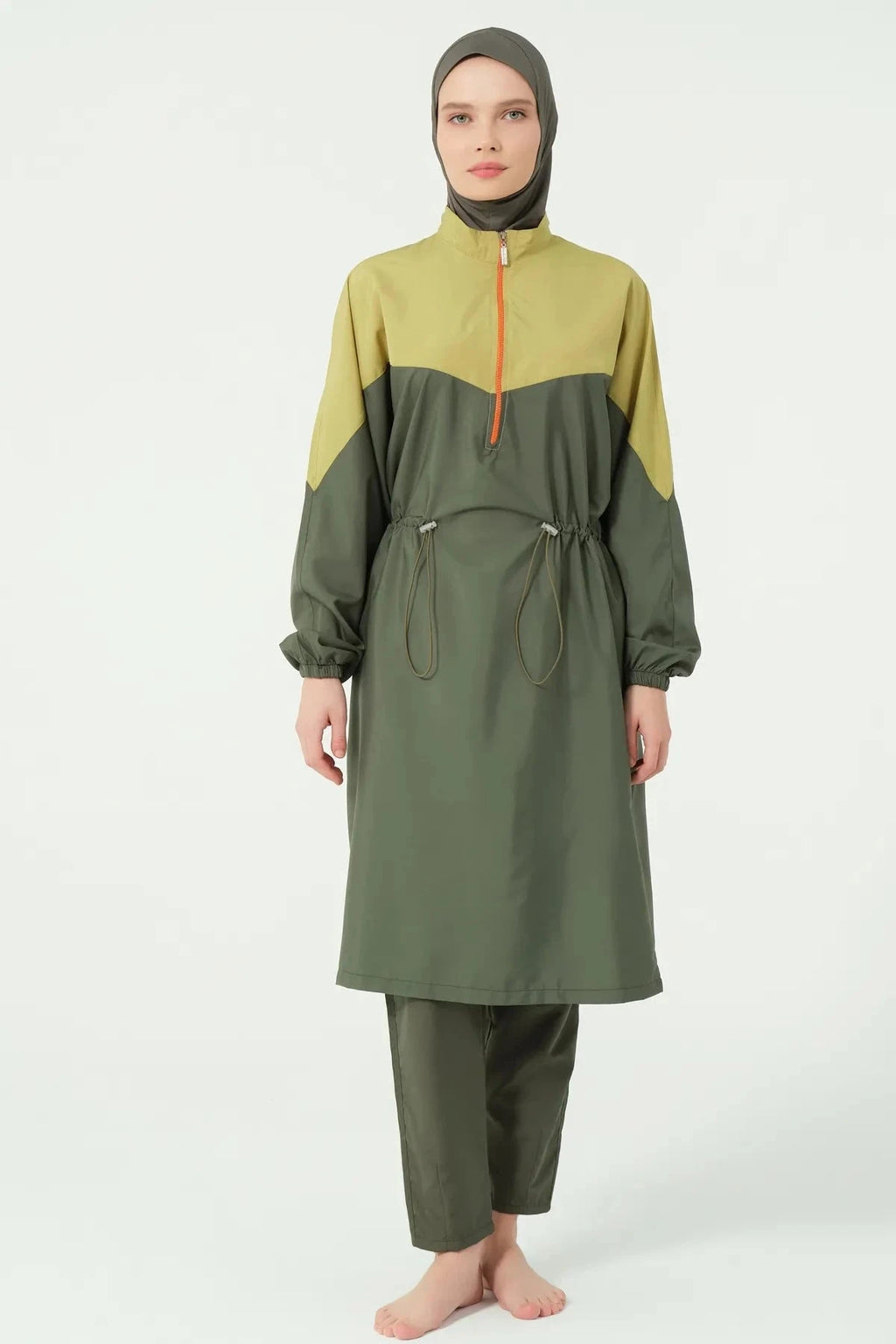Close-up of olive and mustard burkini set with half-zip detail.