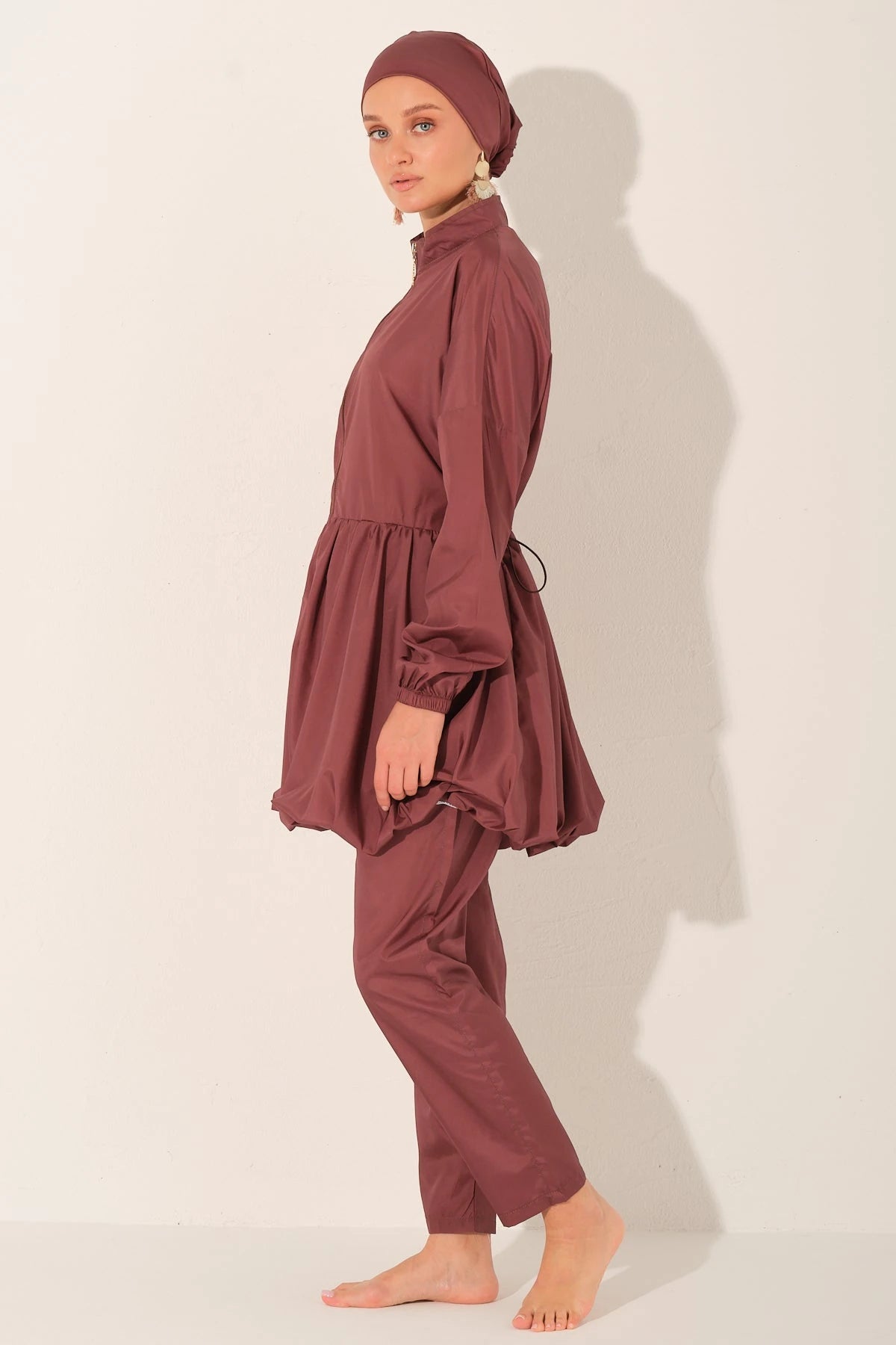 Rosewood burkini set side profile view on a light beige background.