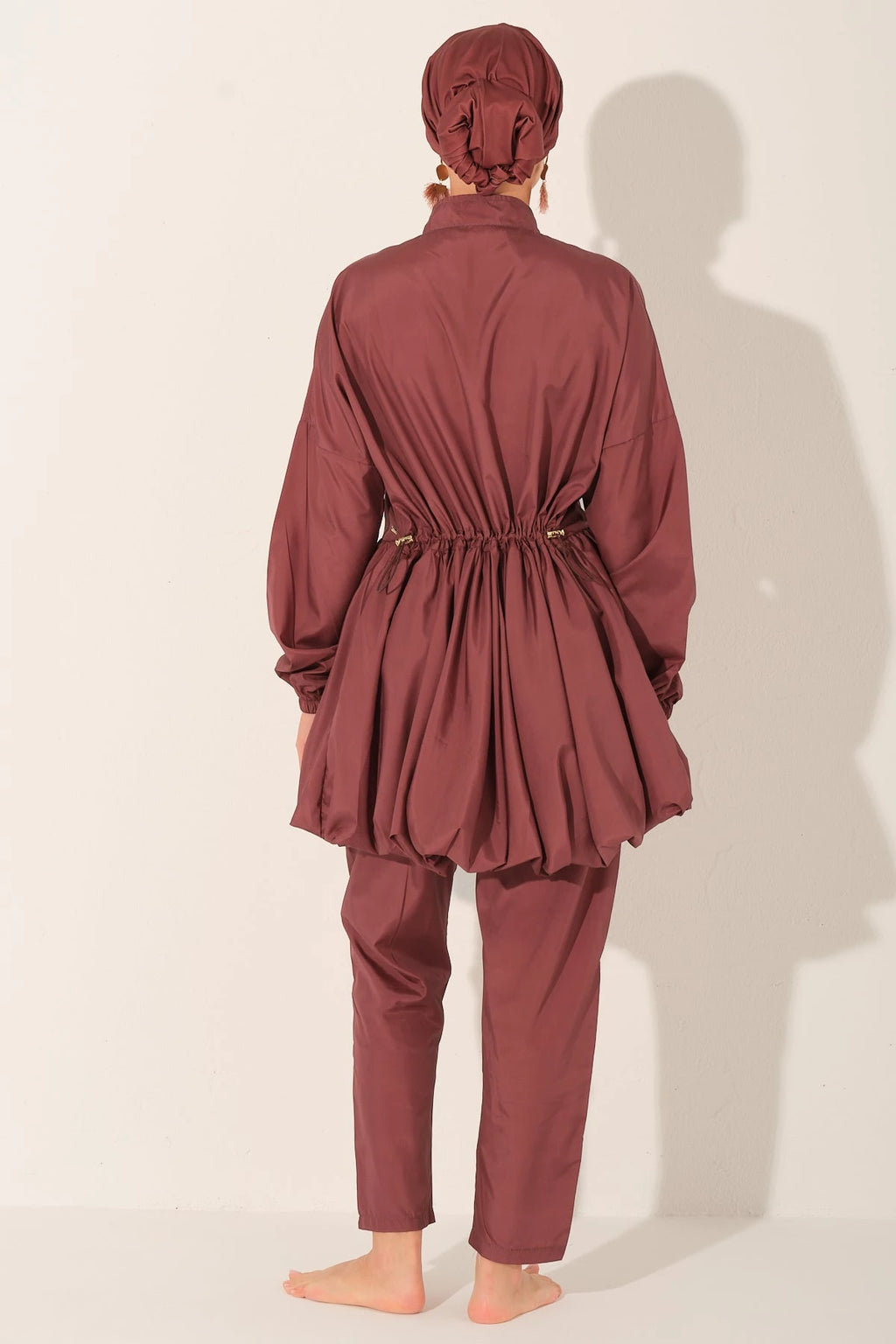 Rosewood burkini set back view showing adjustable drawstring detail.