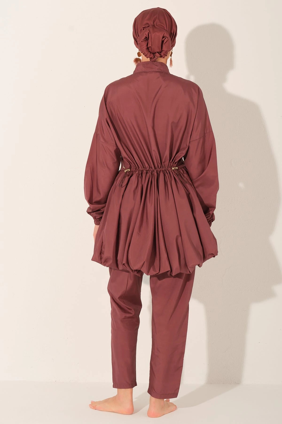 Rosewood burkini set back view showing adjustable drawstring detail.