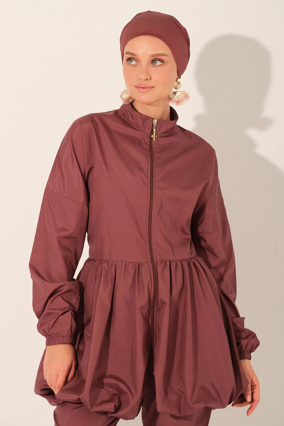 Close-up front view of rosewood burkini top and matching hijab.