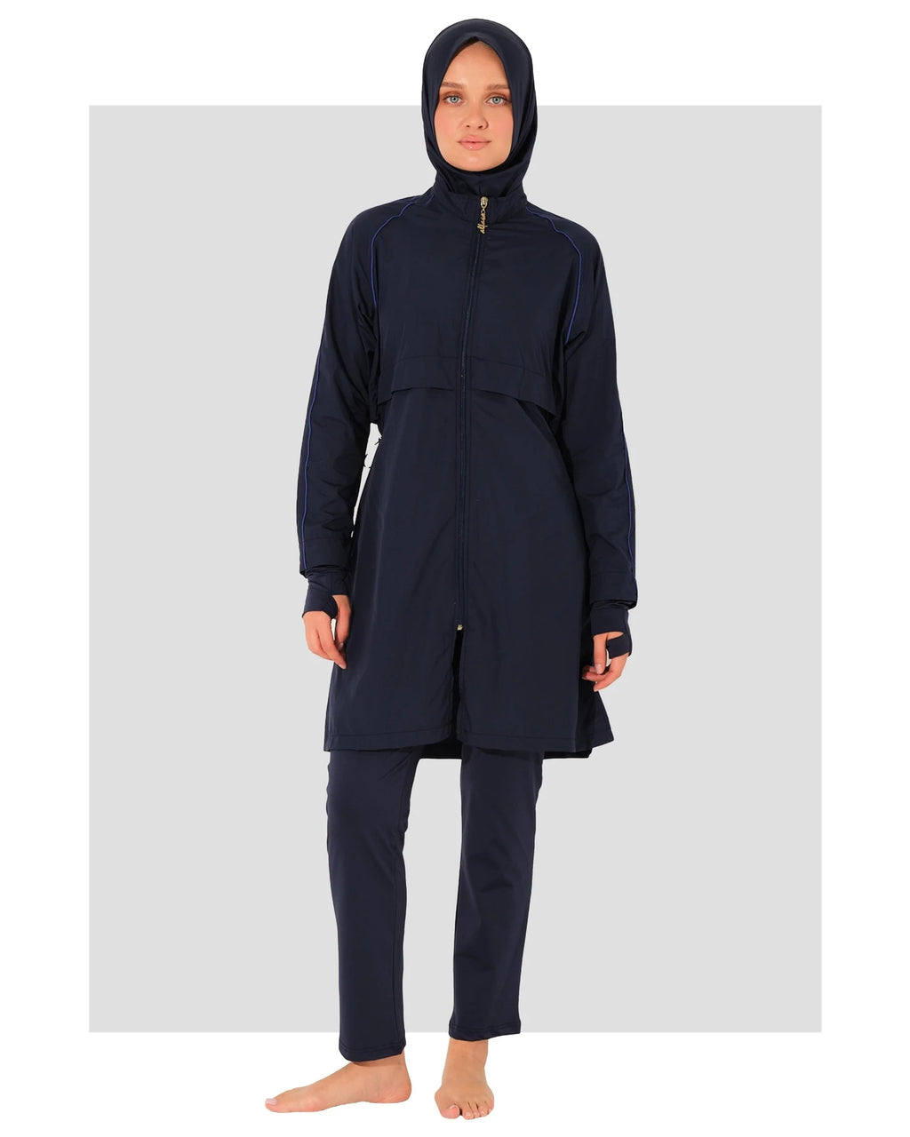 Navy burkini set front view on model with head covering.