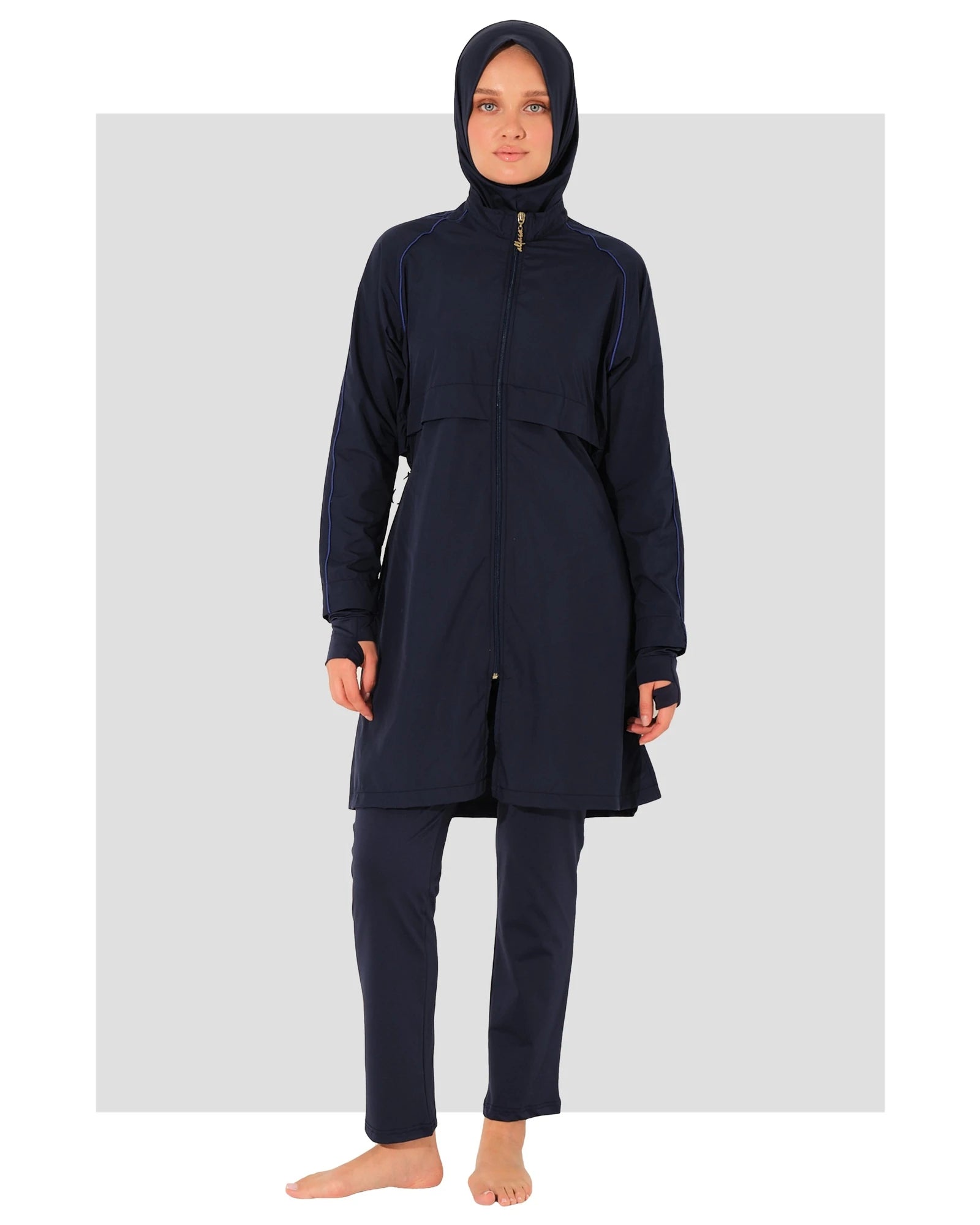 Navy burkini set front view on model with head covering.