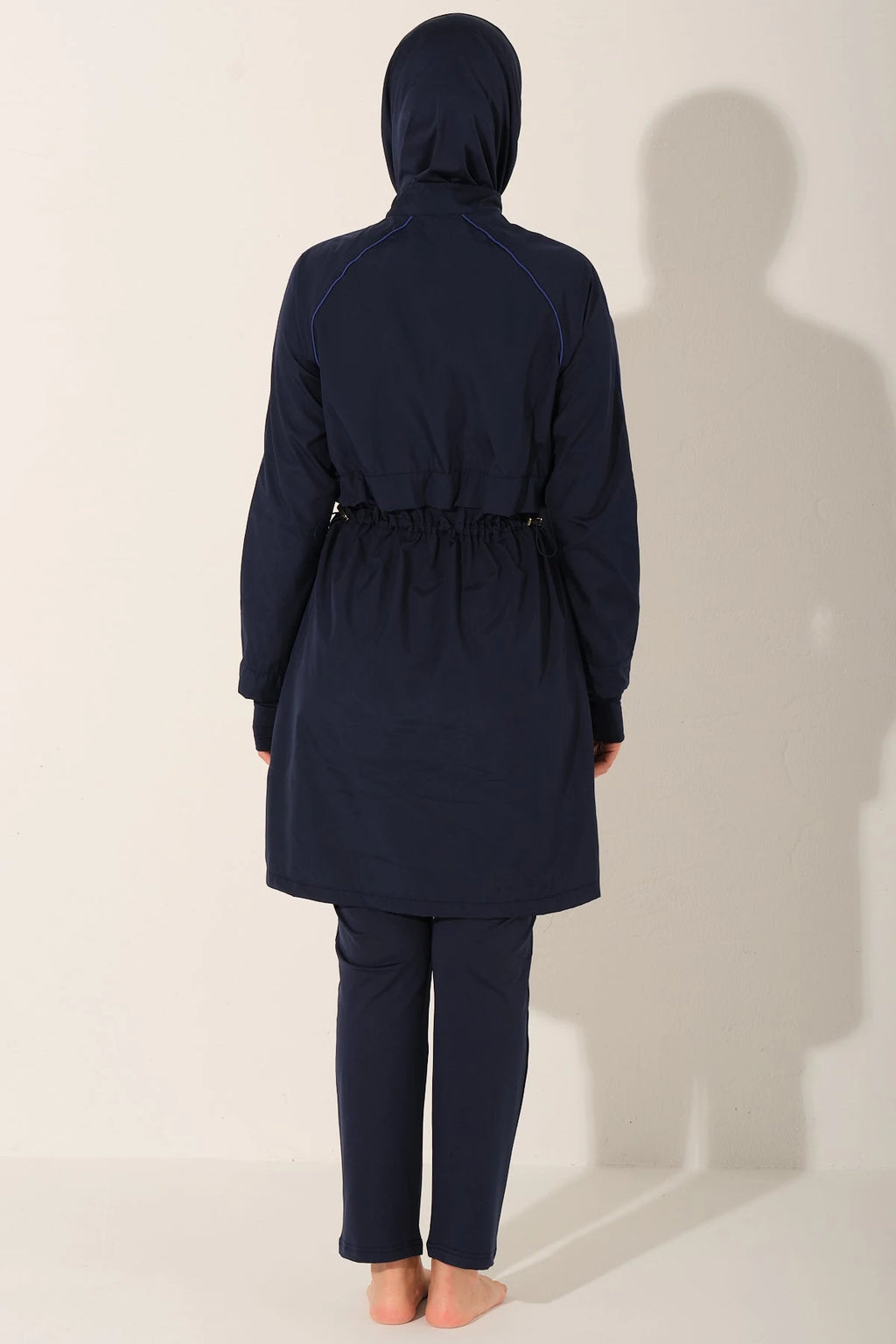 Navy burkini set back view on model showing drawstring waist.