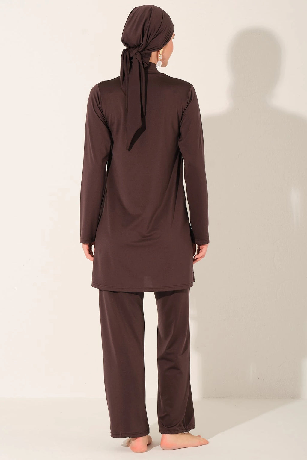 Back view of mocha burkini set on model.