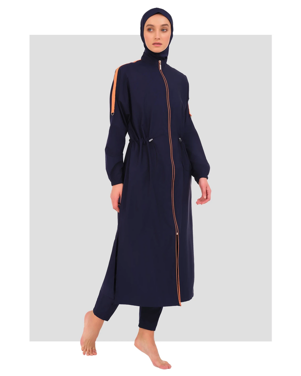Navy blue burkini set with orange stripe accents and full zip, front view.