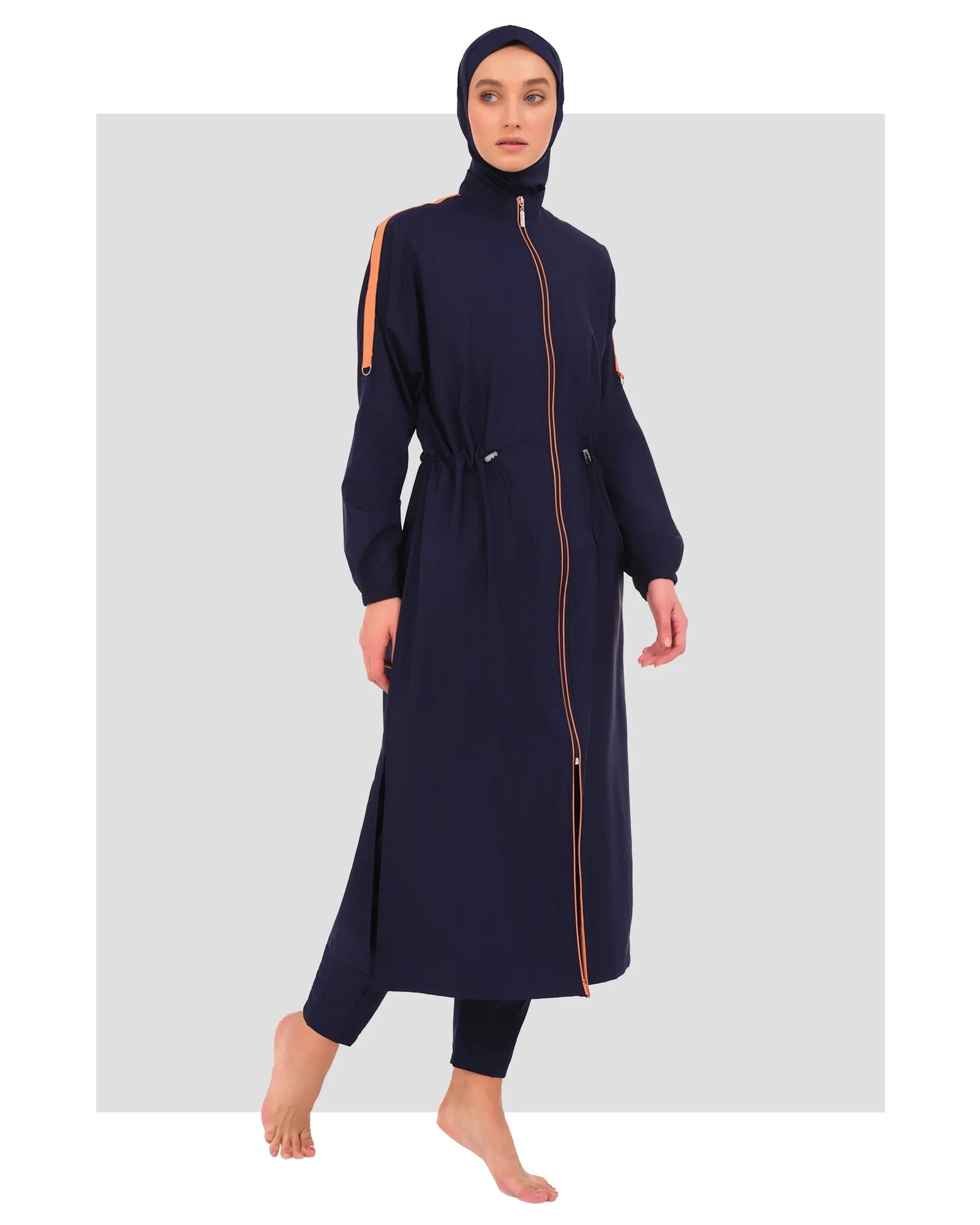 Navy blue burkini set with orange stripe accents and full zip, front view.