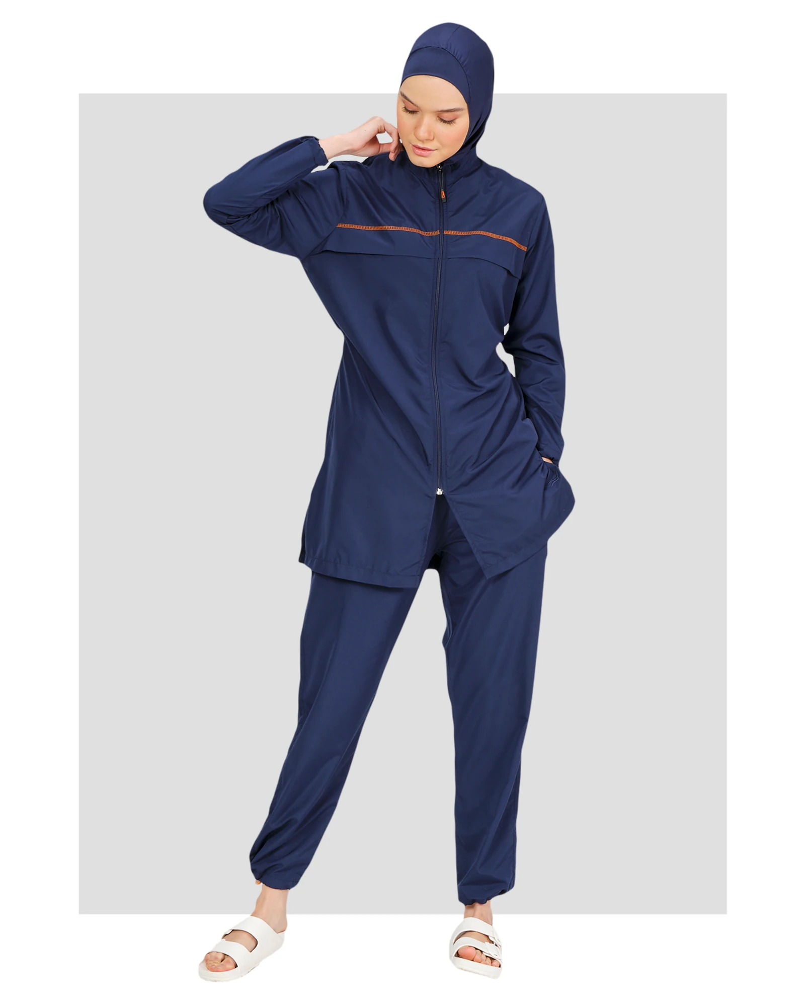 Navy blue burkini set with subtle contrast piping, front view.