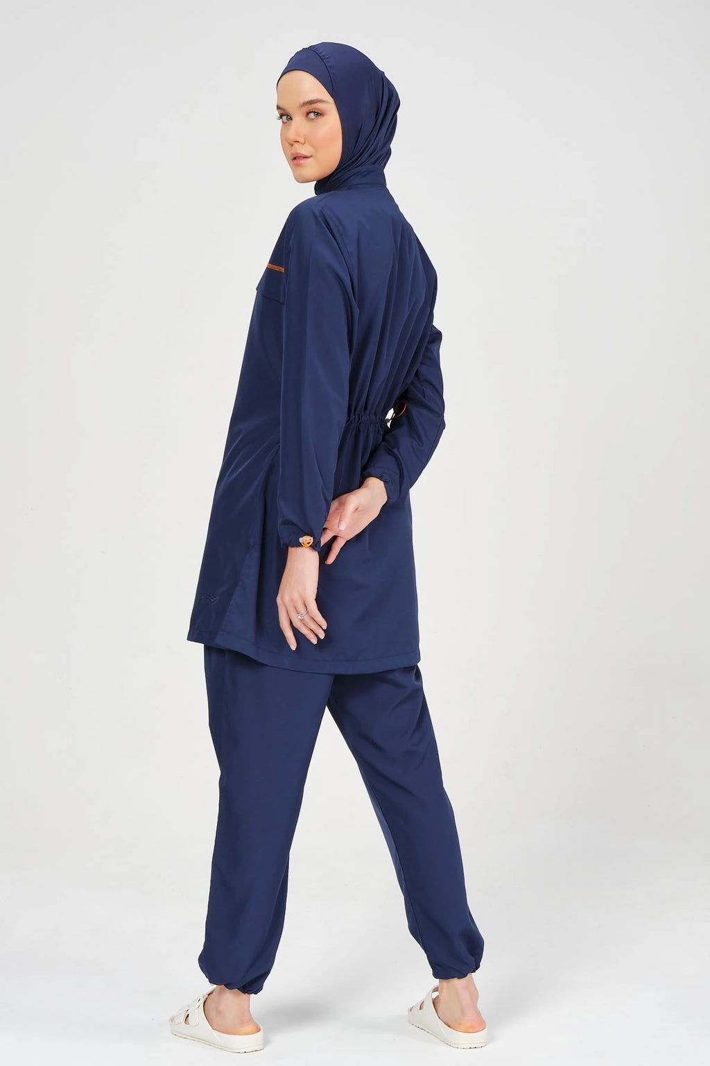Navy blue burkini set back view showing adjustable drawstring detail.