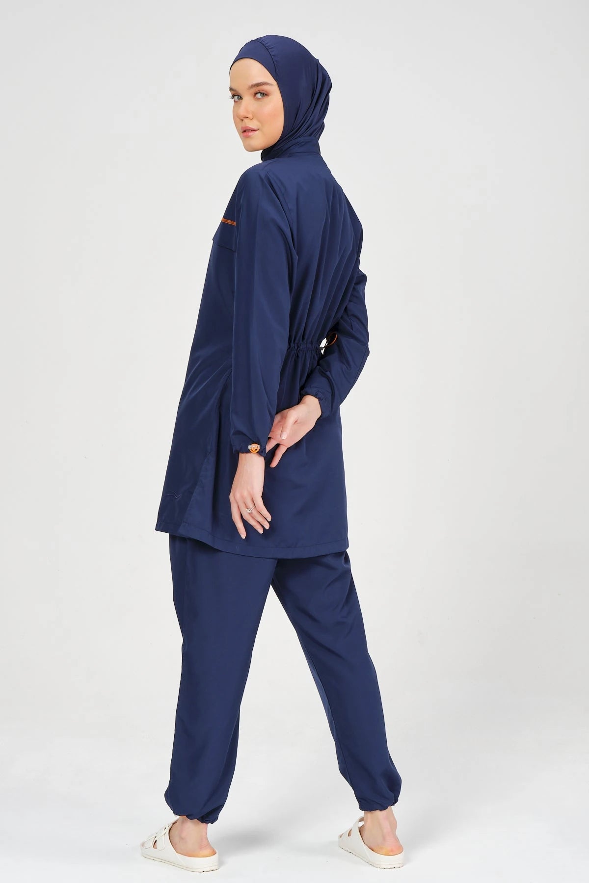 Navy blue burkini set back view showing adjustable drawstring detail.