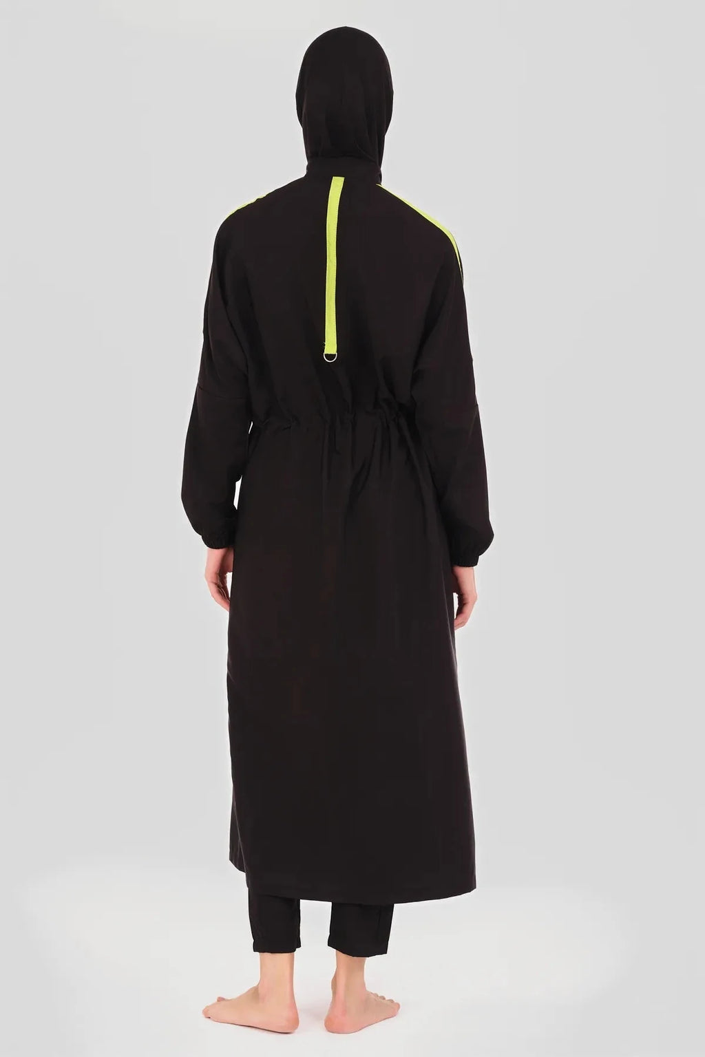 Black burkini jacket with neon green accents and hijab, front view.