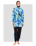 Woman in abstract print burkini set, front view, black hijab.