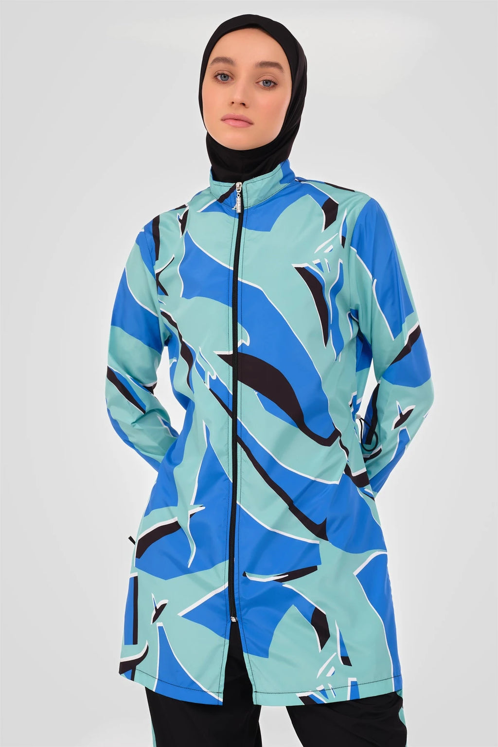 Close-up of abstract print burkini tunic with high neck zipper.