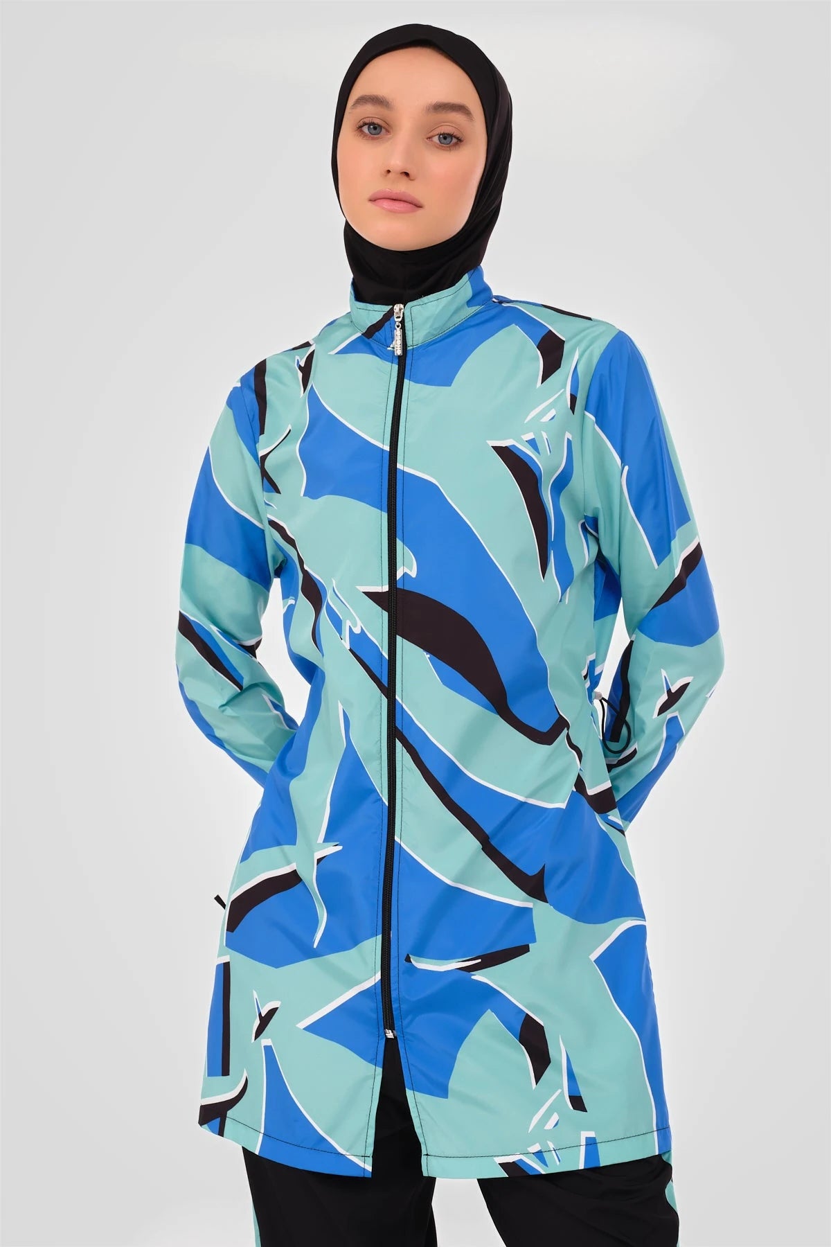 Close-up of abstract print burkini tunic with high neck zipper.