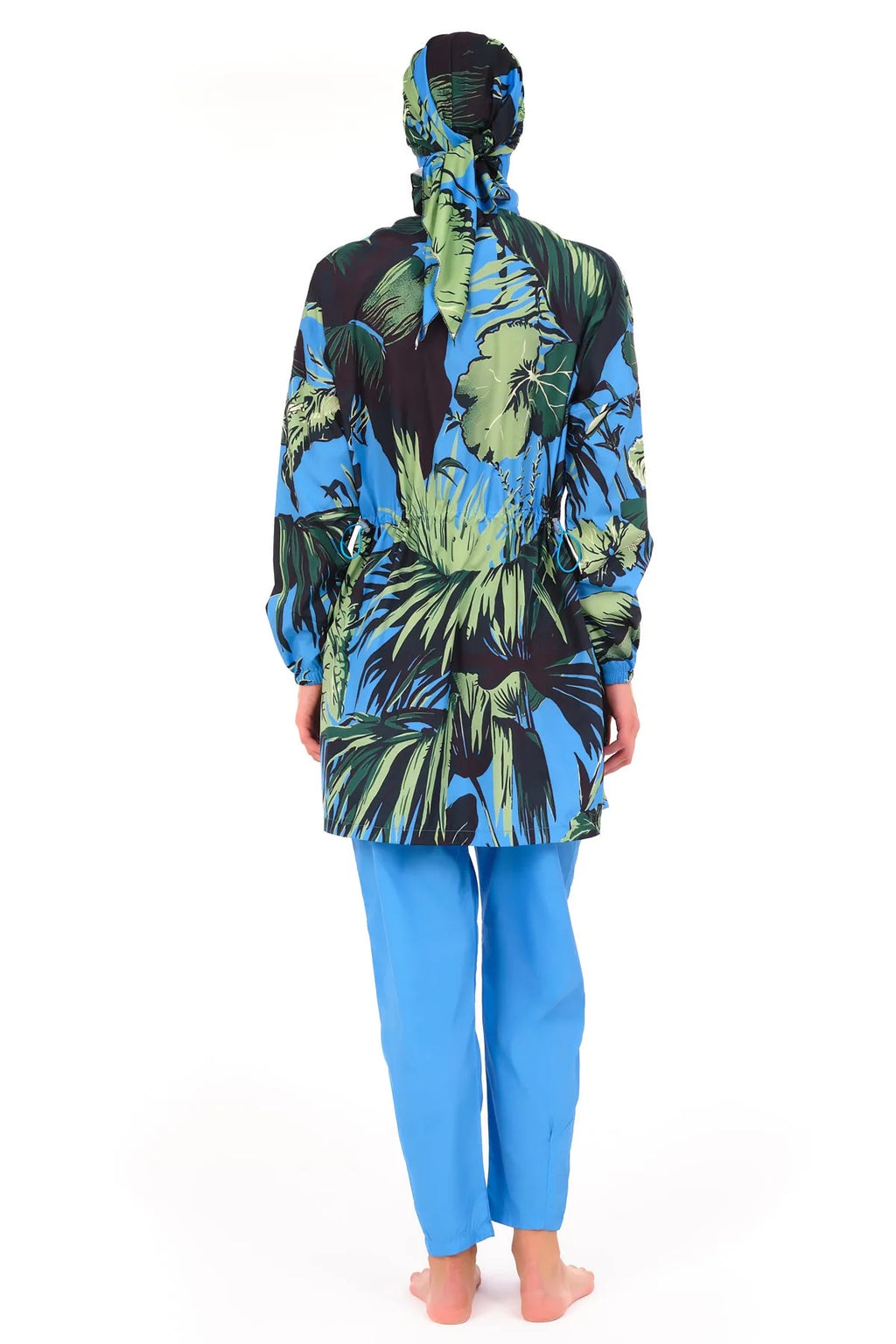 Blue burkini with tropical print sleeves and side panels, back view.
