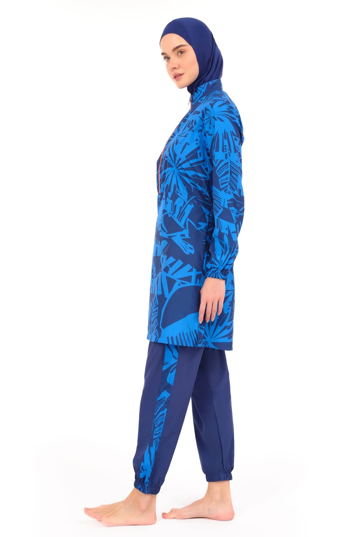 Blue patterned burkini set side view with dark blue swim pants.
