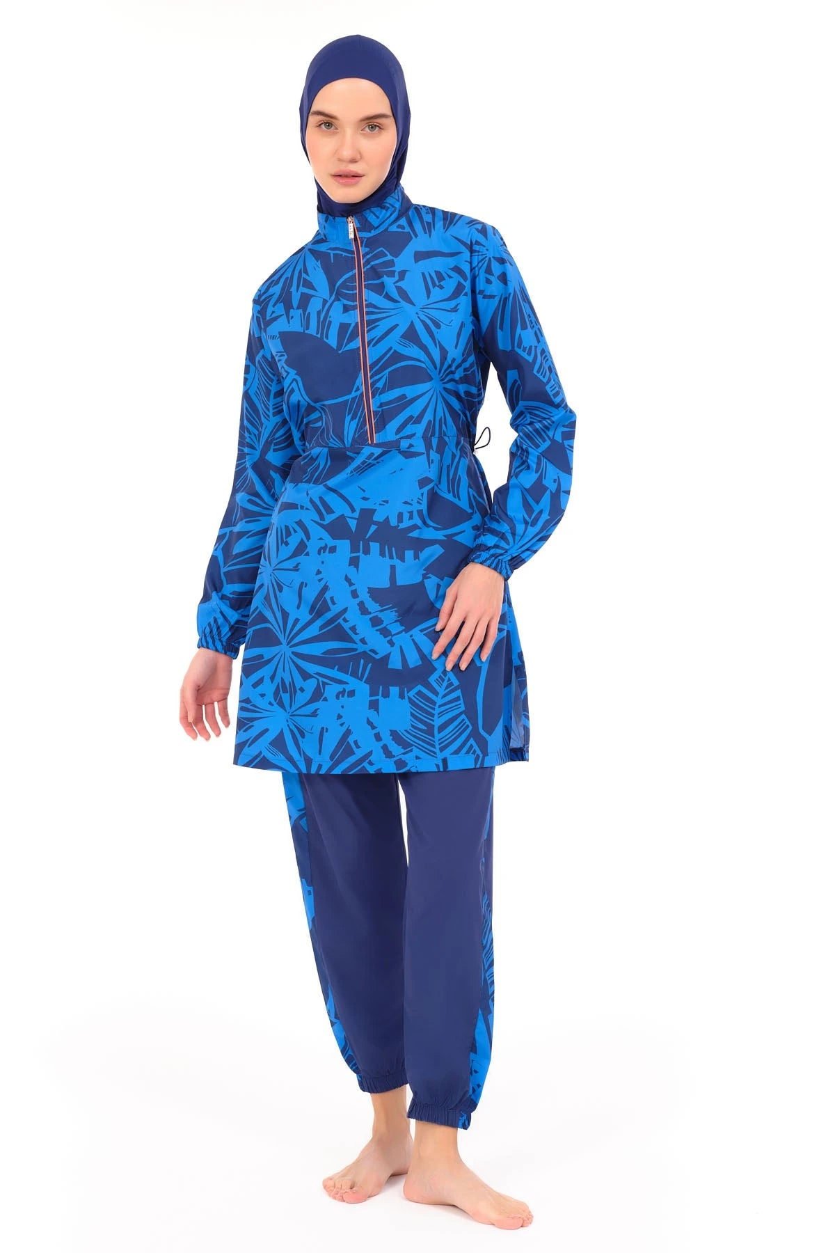Blue patterned burkini set front view, slightly angled, on white background.