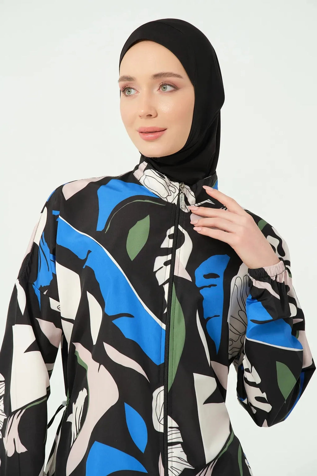 Close-up of burkini high neck and zipper with abstract print.