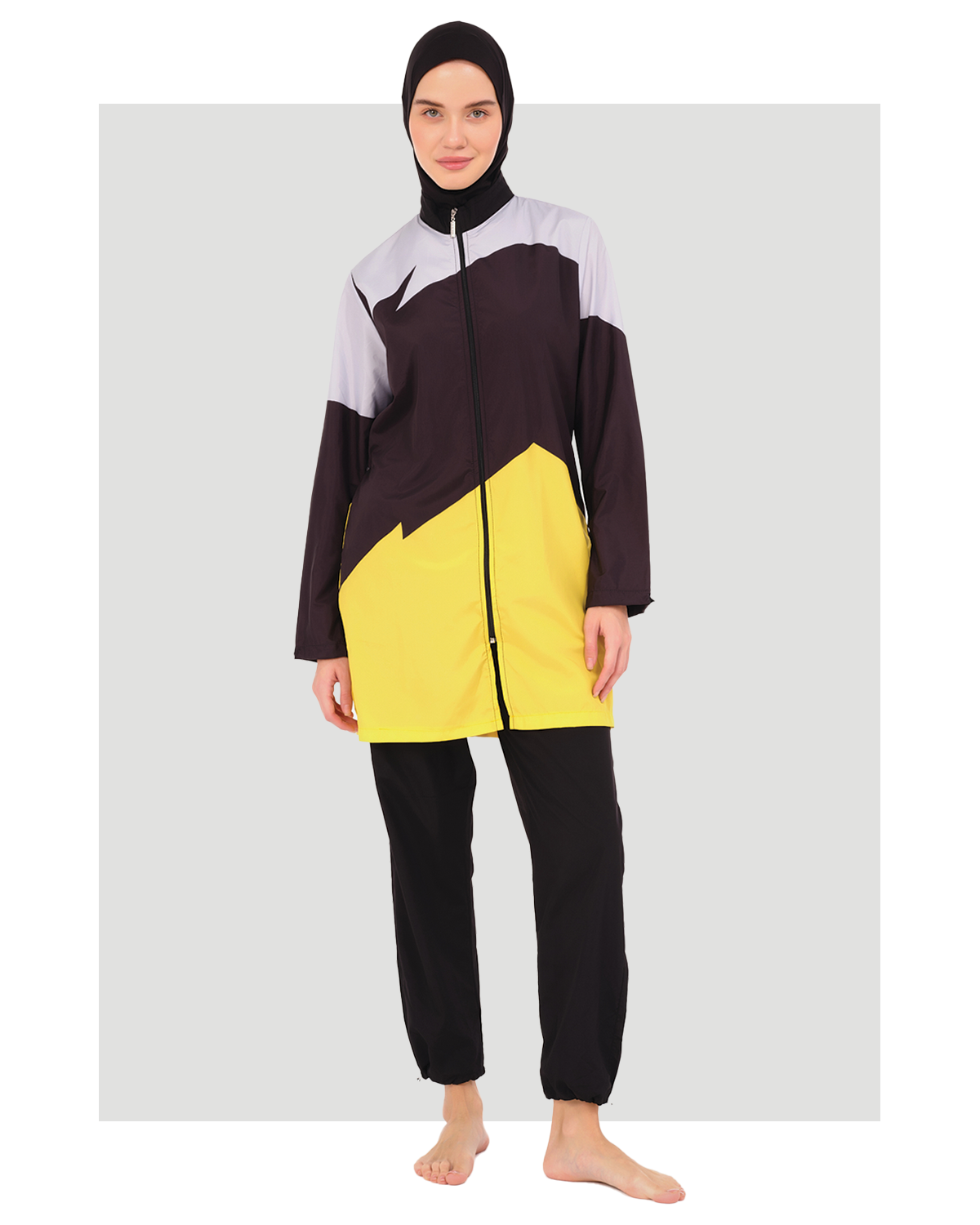 Sporty color-block burkini in black, yellow, and light grey, front view.