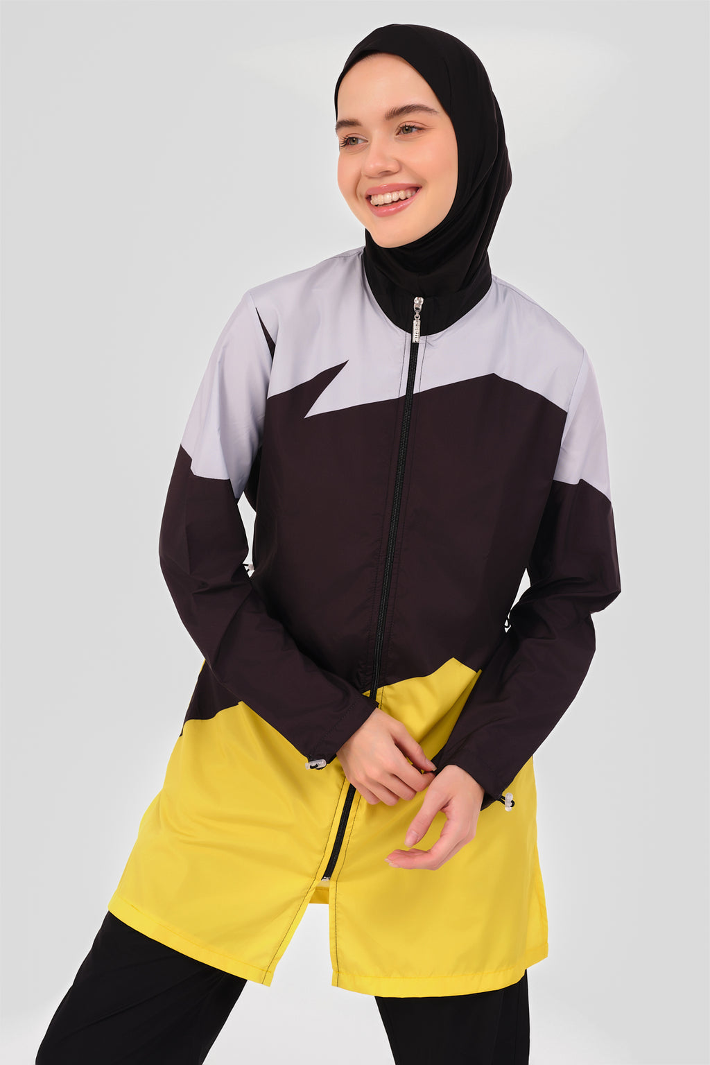 Close-up of sporty color-block burkini showing high neck and color-block design.