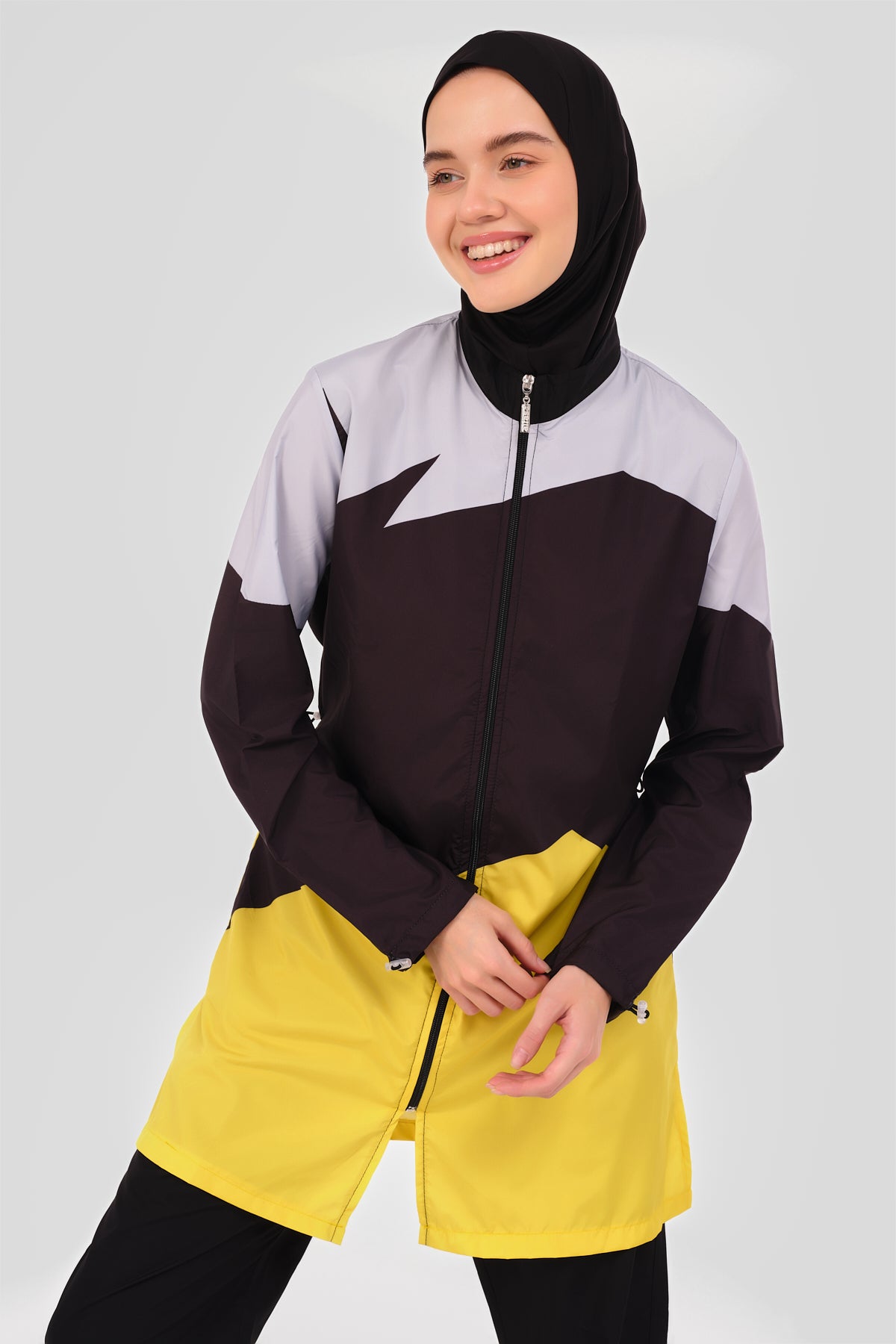 Close-up of sporty color-block burkini showing high neck and color-block design.