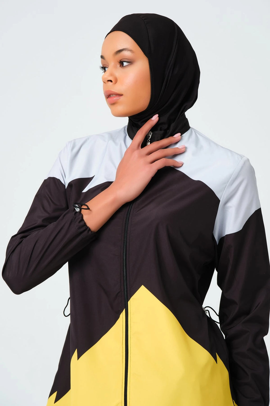 Close-up of sporty color-block burkini showing high neck and color-block design.