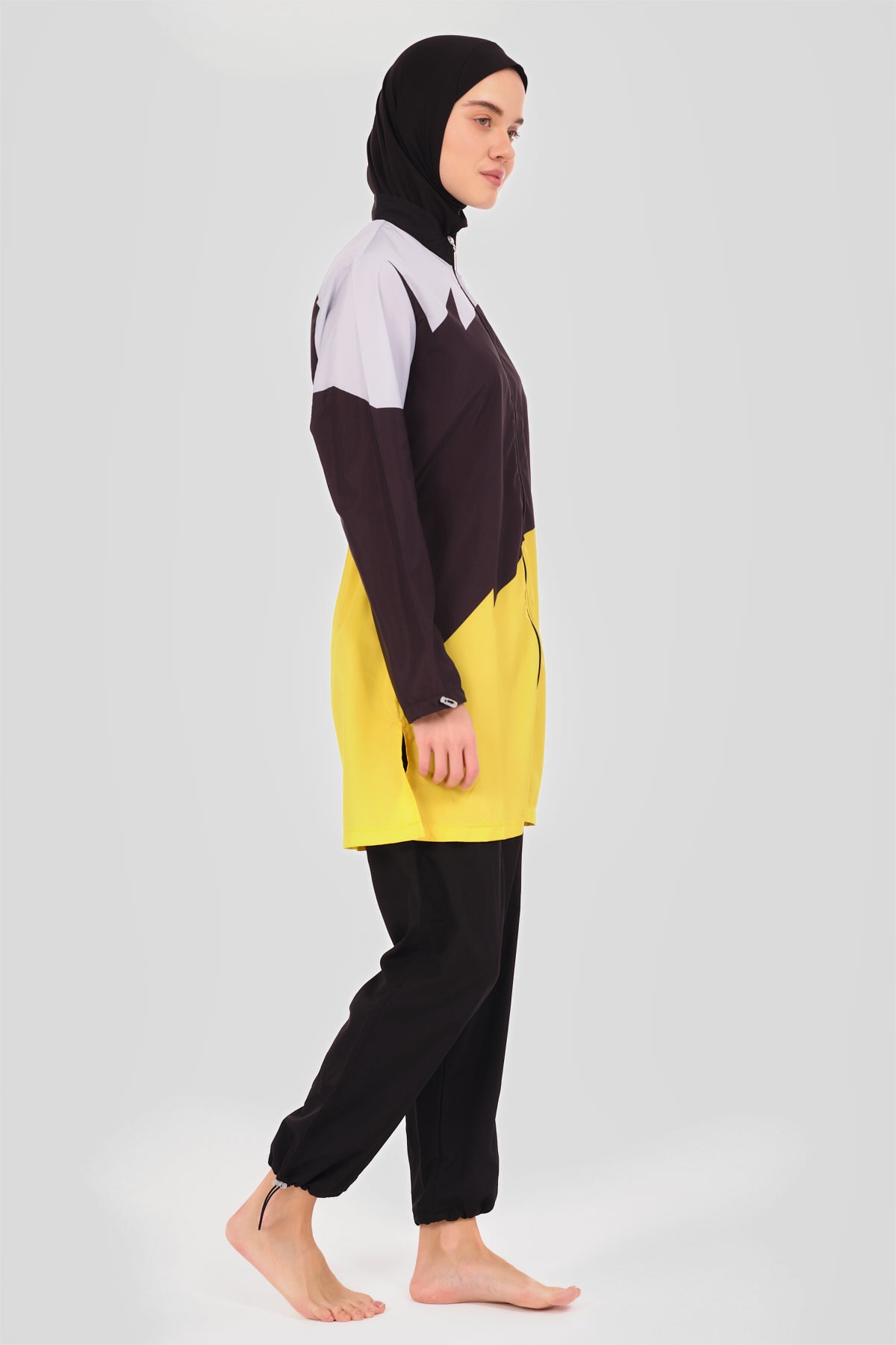 Back close-up of sporty color-block burkini showing color-block and adjustable waist.