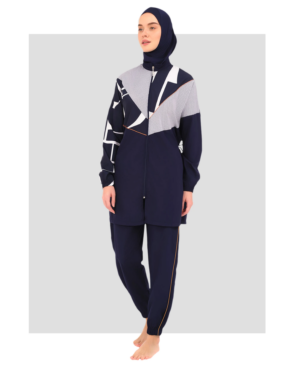 Navy burkini set with geometric print top and plain pants, front view.