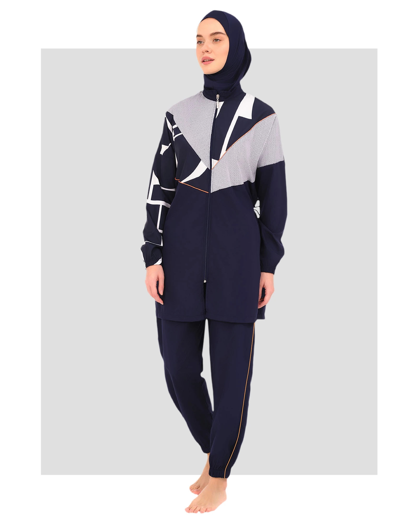 Navy burkini set with geometric print top and plain pants, front view.
