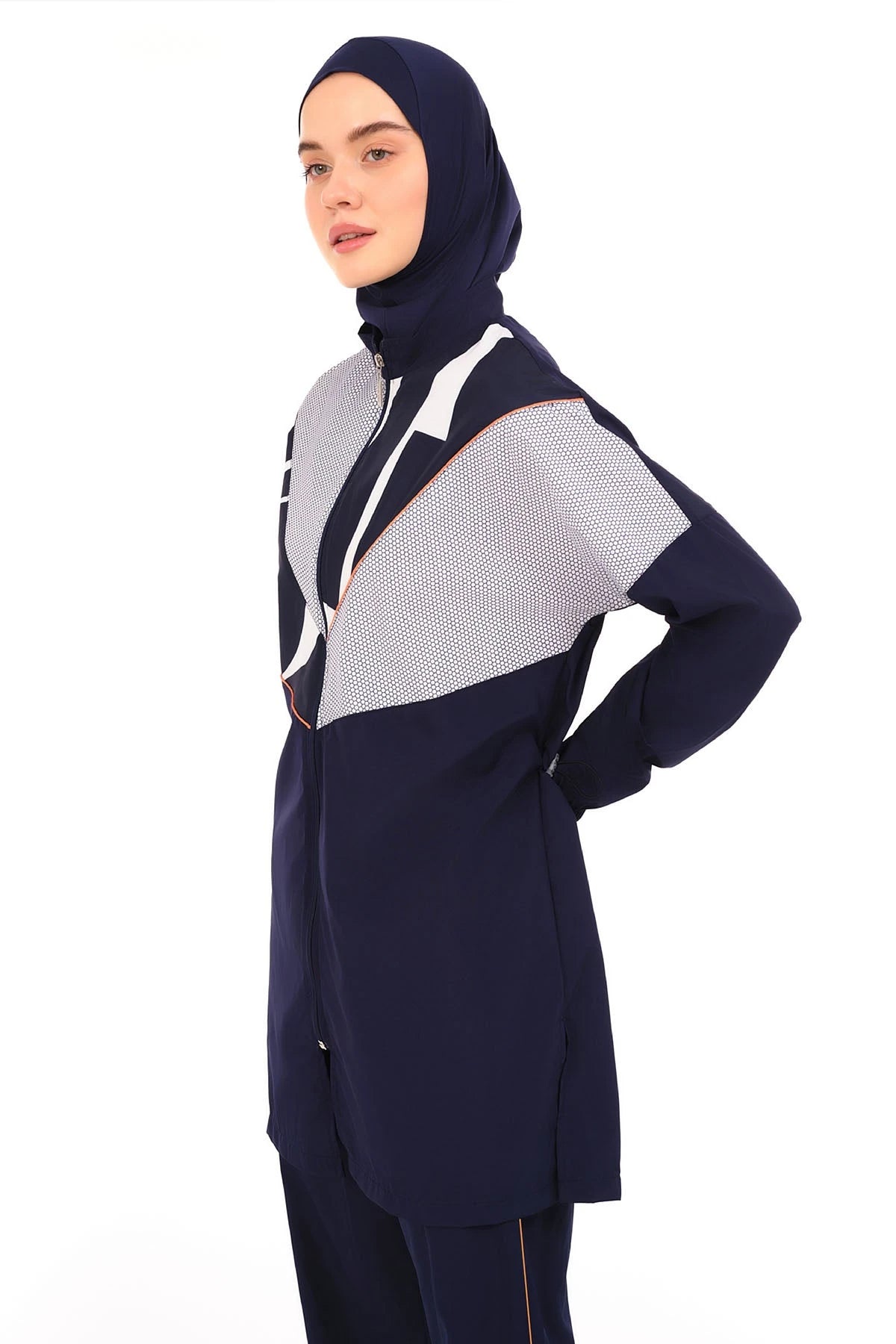Close-up of navy burkini top with geometric print and high neck.