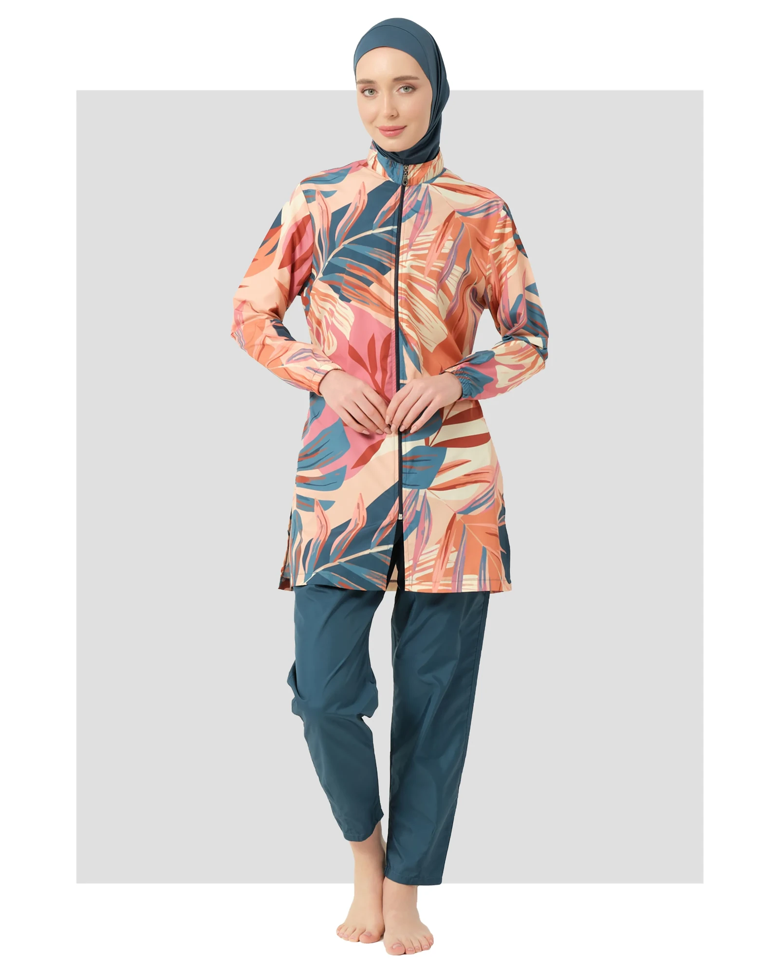 Model in petrol peach tropical burkini set front view.