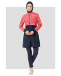 Woman wearing navy and coral tropical print burkini front view.