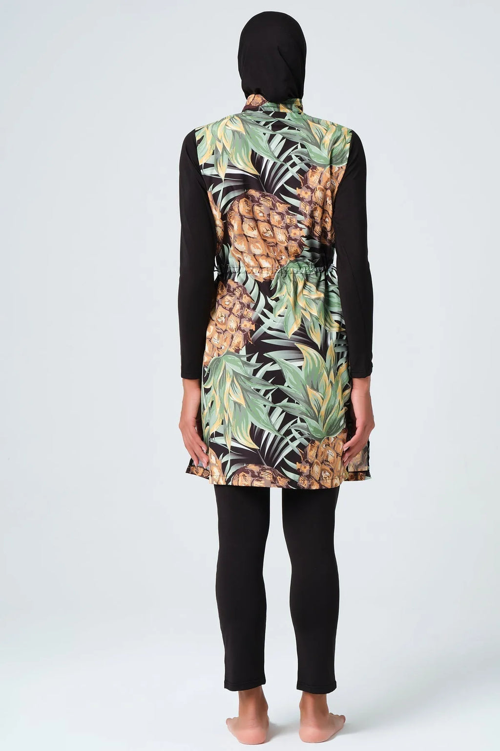 Back view of tropical pineapple print burkini showing drawstring detail.