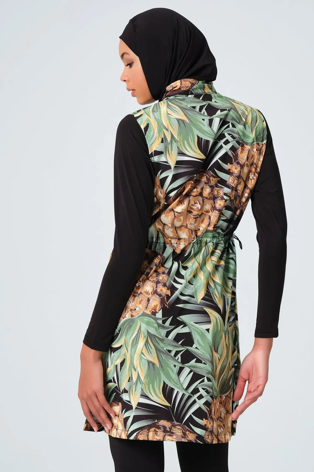 Side and back view of pineapple print burkini with drawstring.