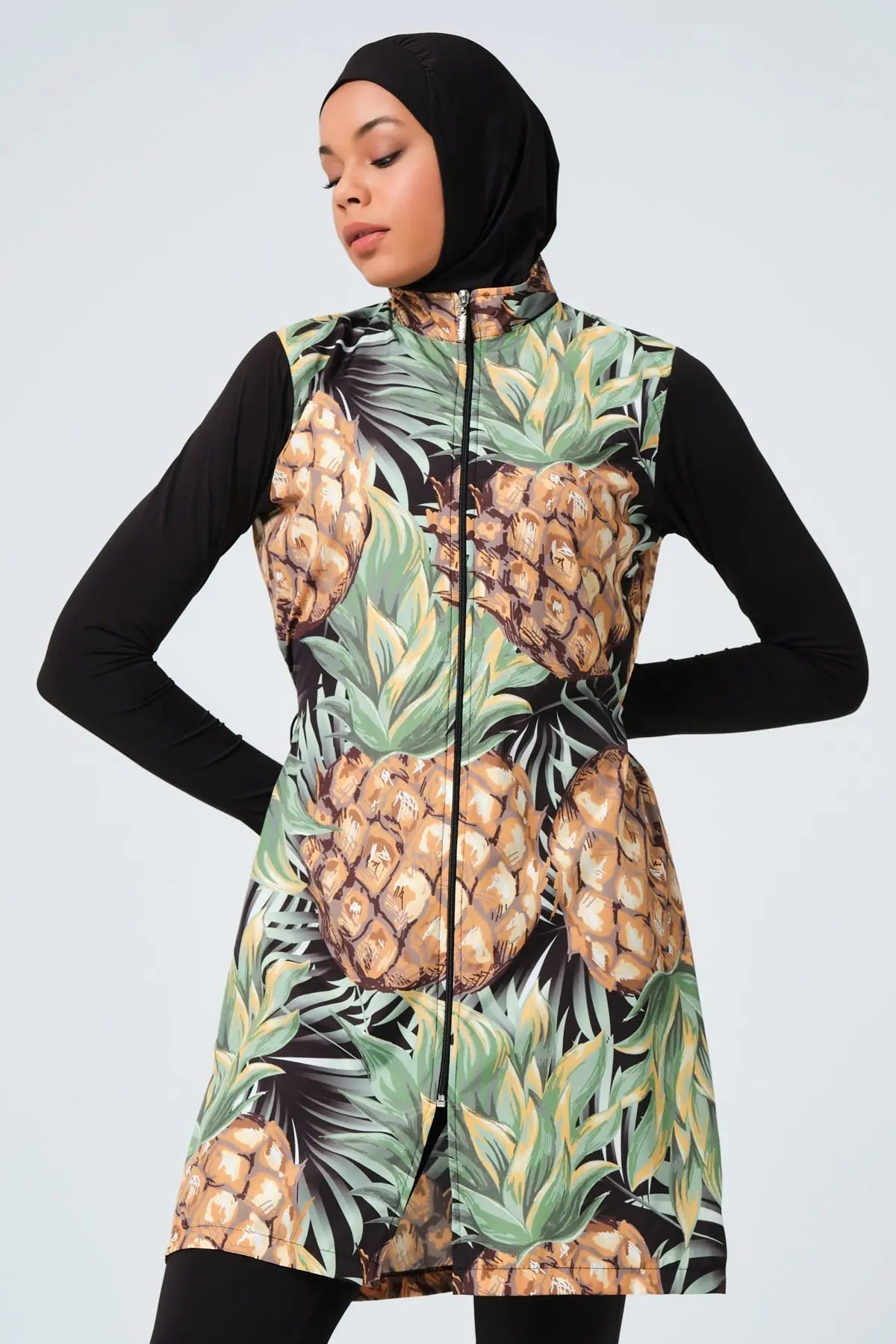Full front view of model wearing tropical pineapple print burkini.