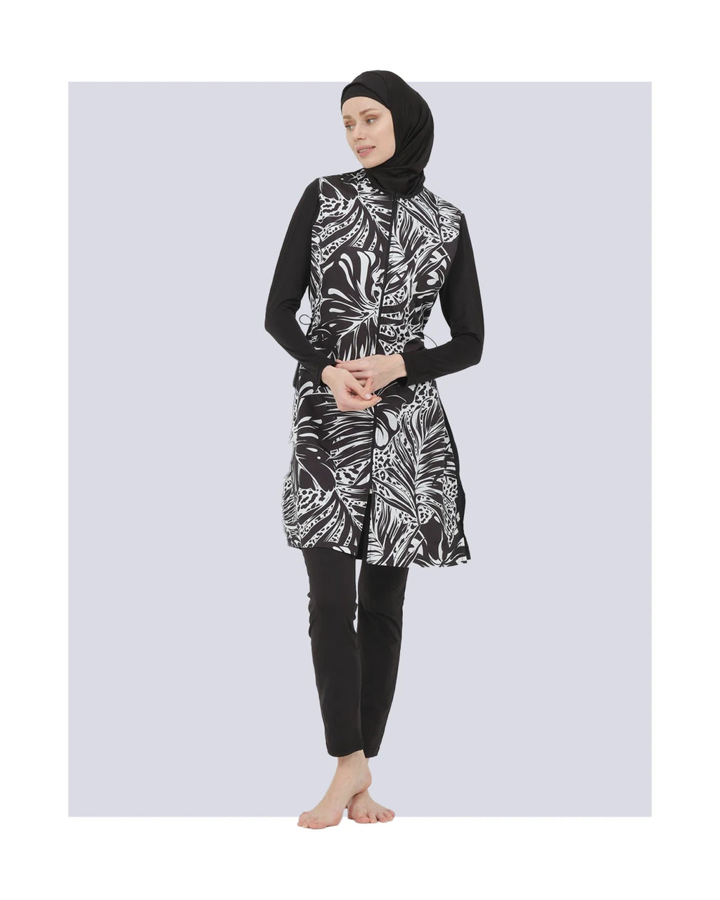 Black and white patterned burkini set front view on model.