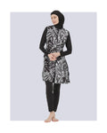 Black and white patterned burkini set front view on model.