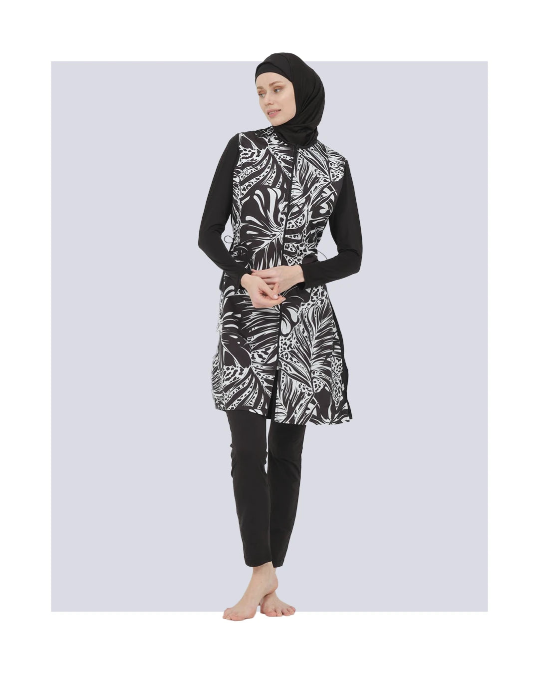 Black and white patterned burkini set front view on model.