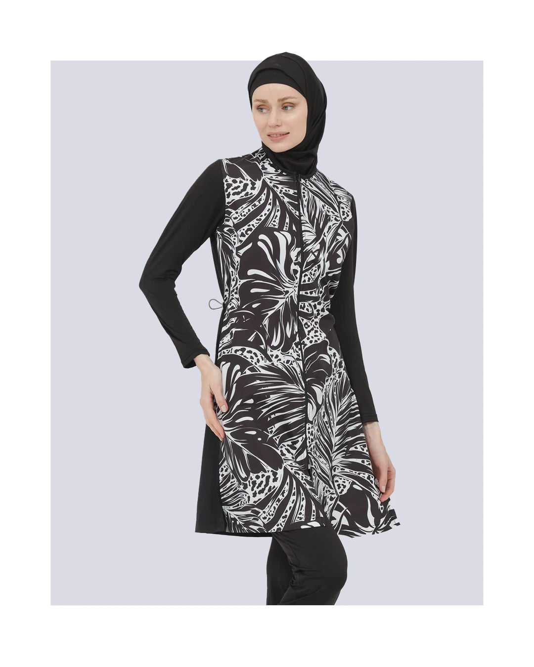 Black and white burkini front-side view showing adjustable waistband.