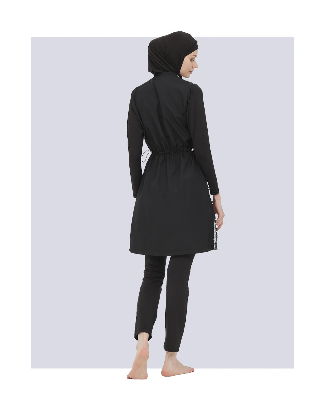 Plain black burkini set back view on model.